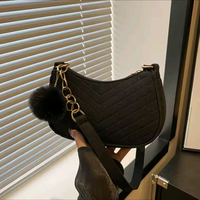Black quilted crossbody bag with chain strap